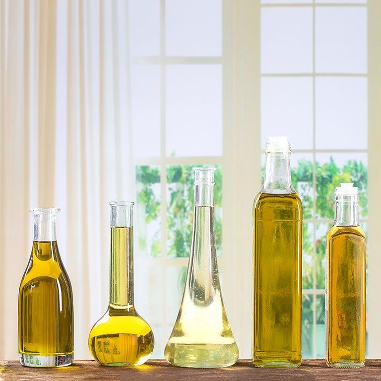 Bottles of refined vegetable oils